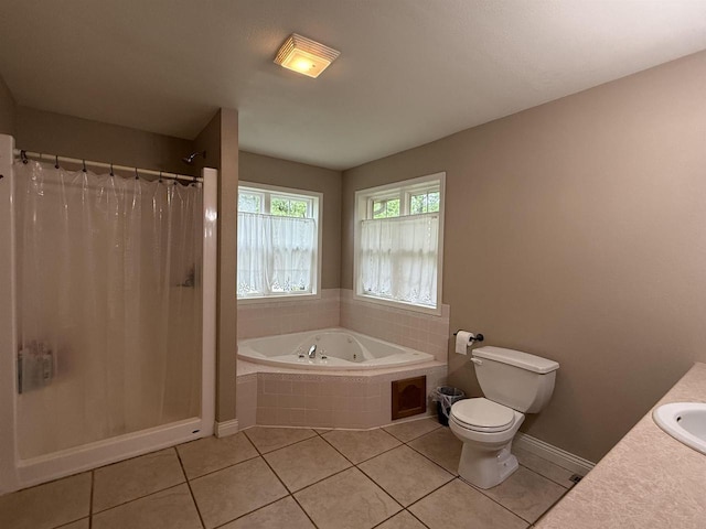 121 Doc Mac Dr, Boscobel, WI 53805 - full bathroom featuring a jetted tub, toilet, a shower stall, and tile patterned floors