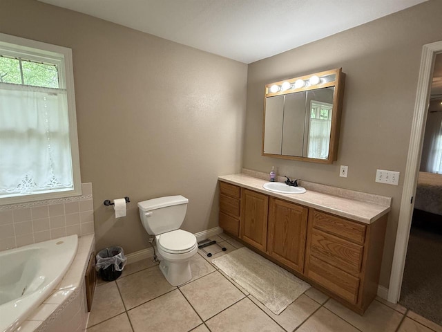 121 Doc Mac Dr, Boscobel, WI 53805 - bathroom with a bath, vanity, toilet, and tile patterned flooring