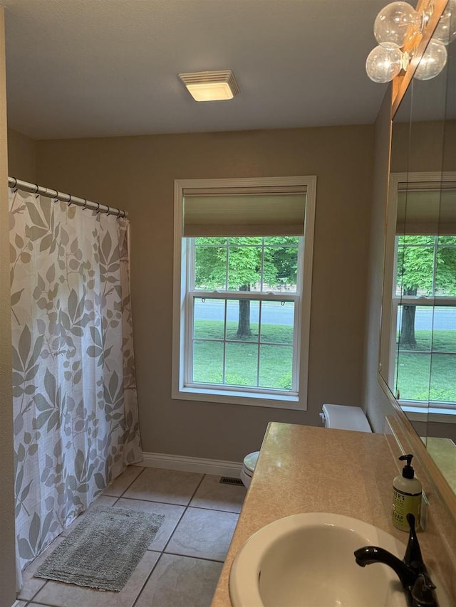 121 Doc Mac Dr, Boscobel, WI 53805 - bathroom with tile patterned flooring, toilet, vanity, baseboards, and a shower with shower curtain