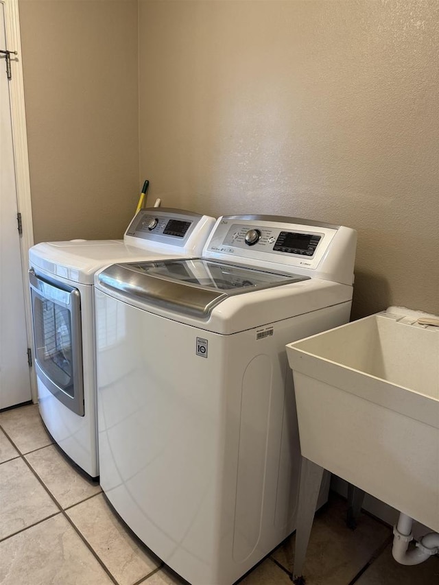 121 Doc Mac Dr, Boscobel, WI 53805 - laundry area with independent washer and dryer and light tile patterned floors