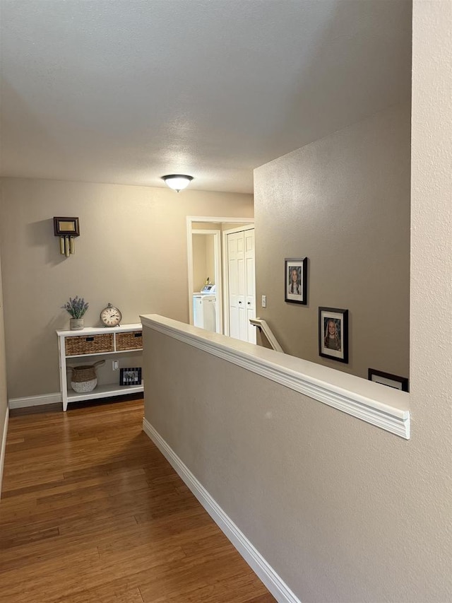 121 Doc Mac Dr, Boscobel, WI 53805 - hall featuring an upstairs landing, wood finished floors, and baseboards
