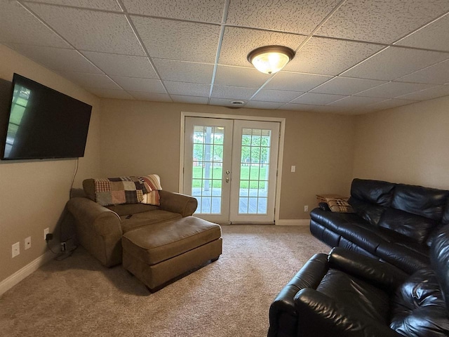 121 Doc Mac Dr, Boscobel, WI 53805 - carpeted living area featuring a paneled ceiling and baseboards