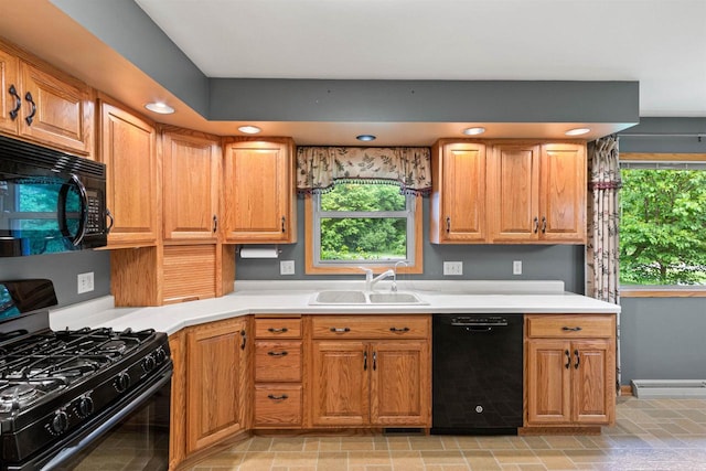 3594 Sunset Dr N, Stevens Point, WI 54482 - kitchen with black appliances, a sink, plenty of natural light, light countertops, and recessed lighting