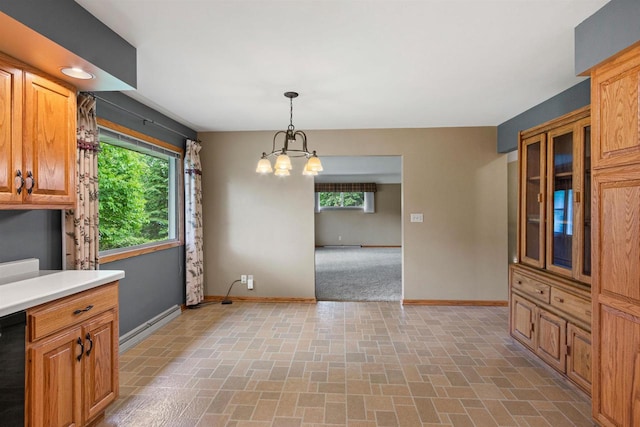 3594 Sunset Dr N, Stevens Point, WI 54482 - unfurnished dining area with baseboards, healthy amount of natural light, and a chandelier