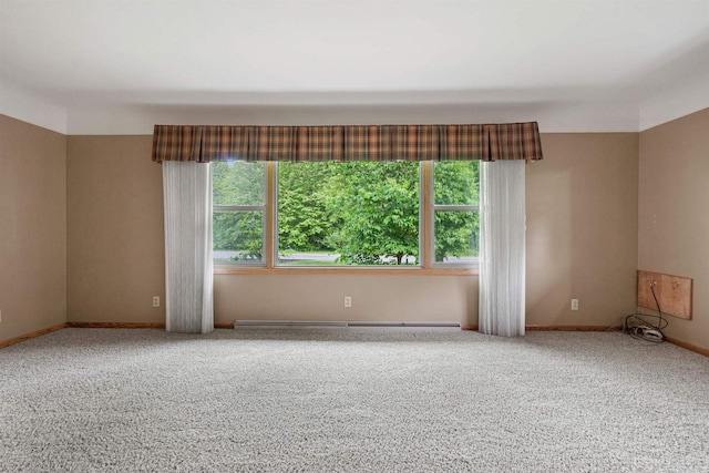 3594 Sunset Dr N, Stevens Point, WI 54482 - empty room with carpet floors, baseboards, and a baseboard heating unit