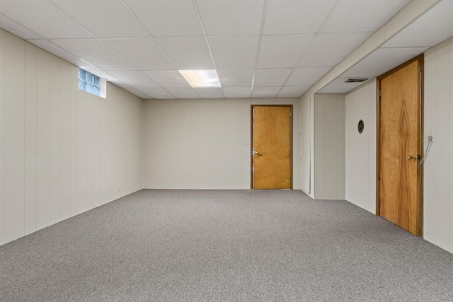 3594 Sunset Dr N, Stevens Point, WI 54482 - below grade area with a drop ceiling, carpet, and wood walls