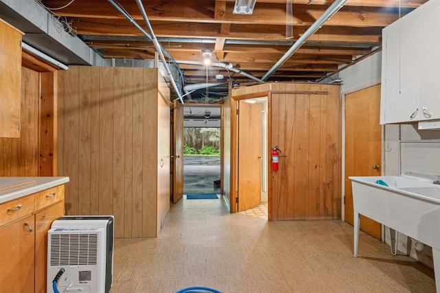 3594 Sunset Dr N, Stevens Point, WI 54482 - basement with wooden walls and light flooring