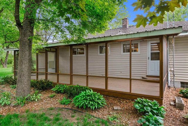 3594 Sunset Dr N, Stevens Point, WI 54482 - view of home's exterior with a chimney and a deck