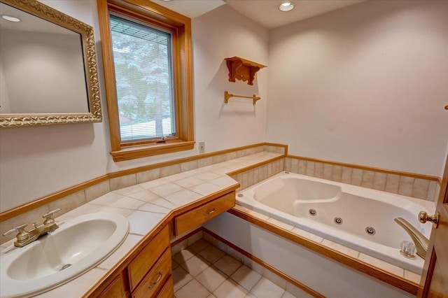 5096 Tuggle Ln, Waunakee, WI 53597 - full bath with a tub with jets, tile patterned flooring, vanity, and recessed lighting