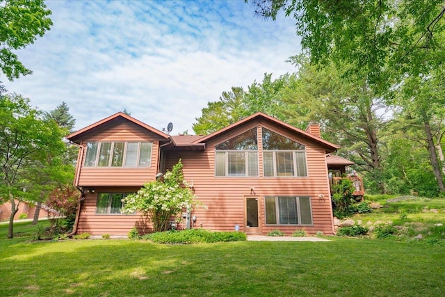 5096 Tuggle Ln, Waunakee, WI 53597 - back of property featuring a chimney and a lawn