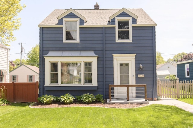 3552 S Pine Ave, Milwaukee, WI 53207 - view of front facade featuring roof with shingles and a chimney