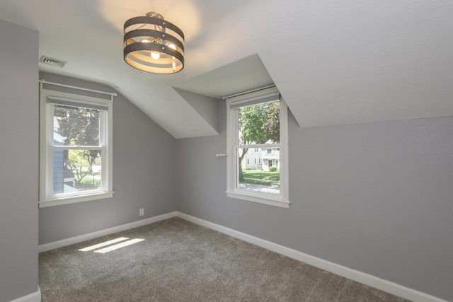 3552 S Pine Ave, Milwaukee, WI 53207 - additional living space with vaulted ceiling, baseboards, carpet, and a chandelier