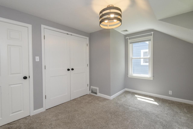 3552 S Pine Ave, Milwaukee, WI 53207 - unfurnished bedroom featuring carpet flooring, a closet, baseboards, and vaulted ceiling