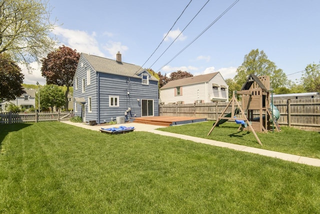 3552 S Pine Ave, Milwaukee, WI 53207 - rear view of house with a wooden deck, a playground, and a chimney