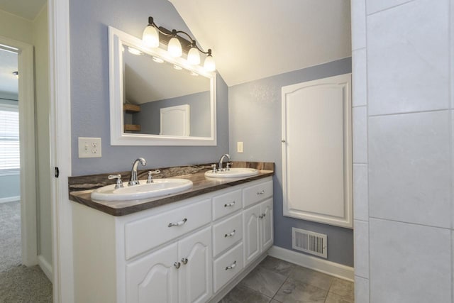 3552 S Pine Ave, Milwaukee, WI 53207 - bathroom with double vanity, baseboards, and vaulted ceiling