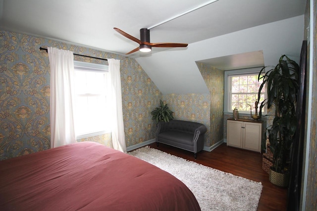 116 N 85th St, Wauwatosa, WI 53226 - bedroom featuring wood finished floors, multiple windows, vaulted ceiling, baseboards, and wallpapered walls