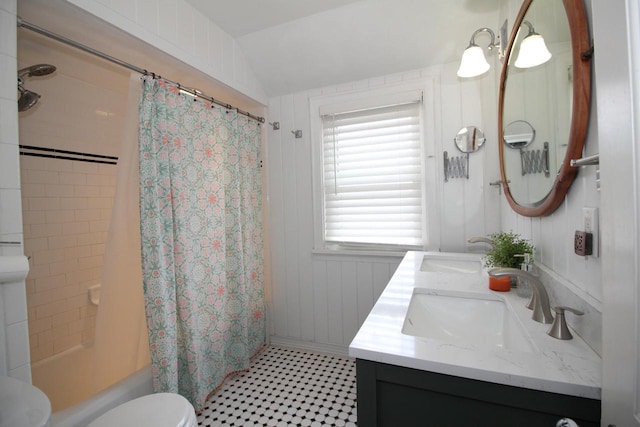 116 N 85th St, Wauwatosa, WI 53226 - bathroom featuring double vanity, shower / tub combo with curtain, toilet, lofted ceiling, and tile patterned floors