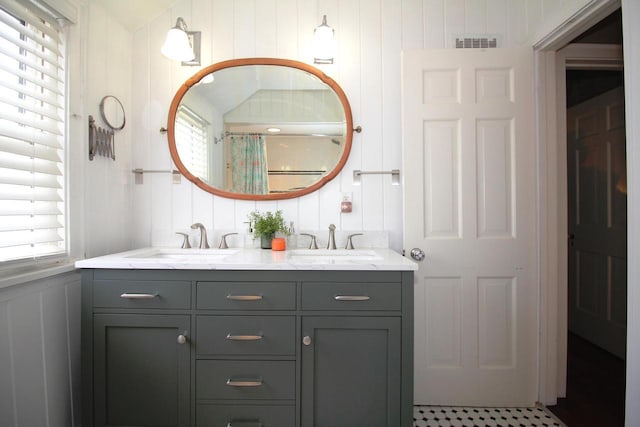 116 N 85th St, Wauwatosa, WI 53226 - bathroom with a decorative wall, double vanity, healthy amount of natural light, and a shower with shower curtain