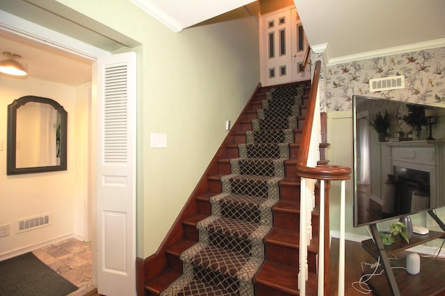 116 N 85th St, Wauwatosa, WI 53226 - stairway featuring crown molding, baseboards, and wallpapered walls