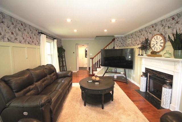 116 N 85th St, Wauwatosa, WI 53226 - living area featuring crown molding, wallpapered walls, stairs, wood finished floors, and a fireplace with flush hearth