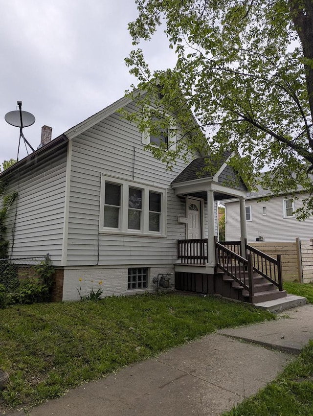110 W Center St, Milwaukee, WI 53212 - view of front of home featuring a chimney