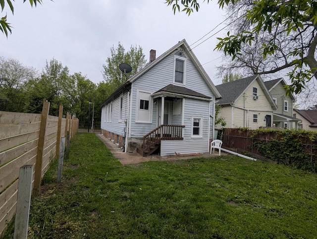 110 W Center St, Milwaukee, WI 53212 - rear view of house with a chimney