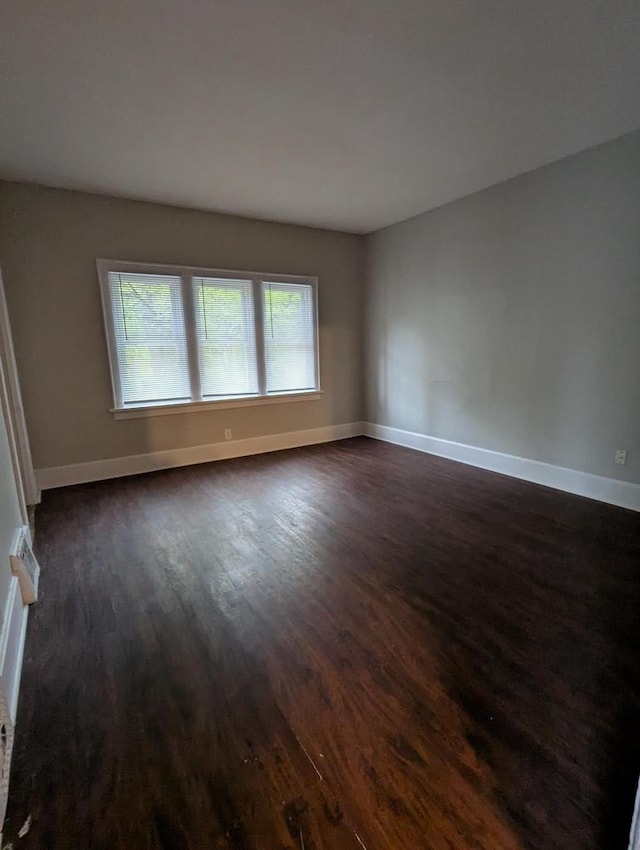 110 W Center St, Milwaukee, WI 53212 - spare room with dark wood-style floors and baseboards