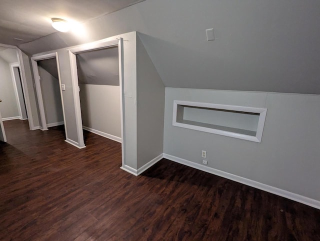 110 W Center St, Milwaukee, WI 53212 - additional living space with dark wood finished floors, lofted ceiling, and baseboards