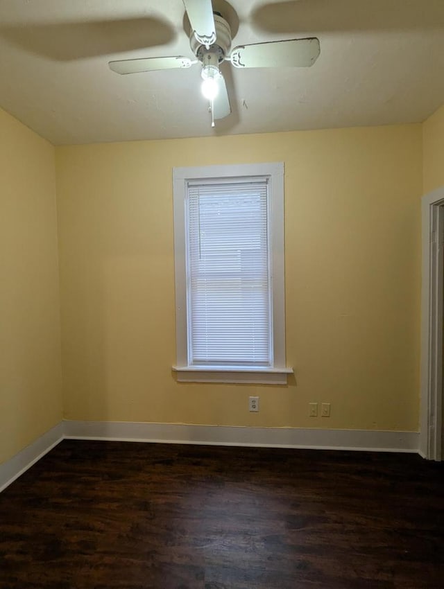 110 W Center St, Milwaukee, WI 53212 - spare room with dark wood-style floors, a ceiling fan, and baseboards