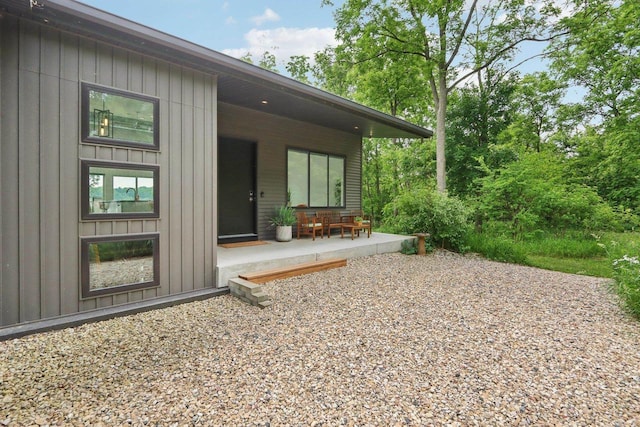 303 Craig Rd, Edgerton, WI 53534 - view of exterior entry featuring board and batten siding