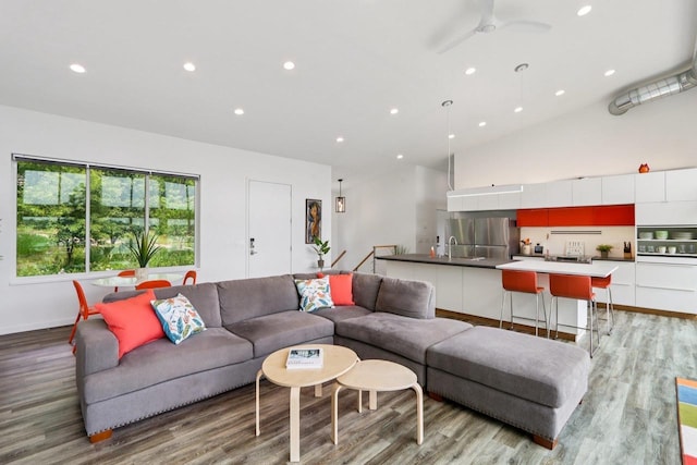 303 Craig Rd, Edgerton, WI 53534 - living room with light wood-type flooring, recessed lighting, a ceiling fan, and vaulted ceiling