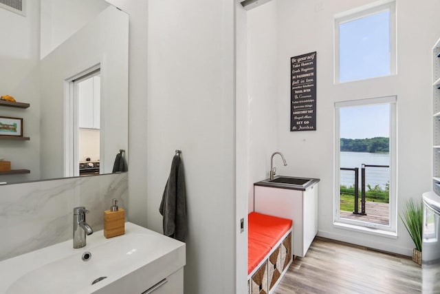 303 Craig Rd, Edgerton, WI 53534 - bathroom with wood finished floors, vanity, and a water view