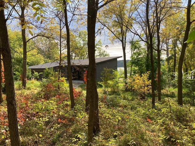 303 Craig Rd, Edgerton, WI 53534 - view of home's exterior featuring a forest view