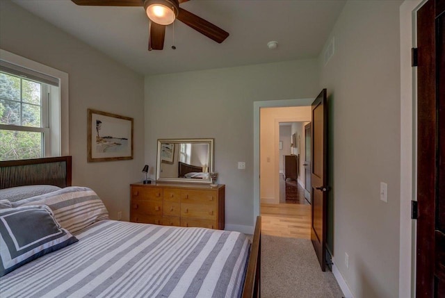 5508 Midmoor Rd, Monona, WI 53716 - bedroom with baseboards, light colored carpet, and a ceiling fan