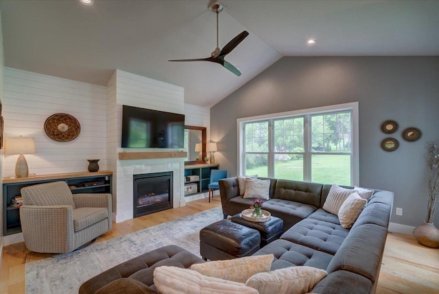 5508 Midmoor Rd, Monona, WI 53716 - living area with ceiling fan, high vaulted ceiling, wood finished floors, a glass covered fireplace, and recessed lighting