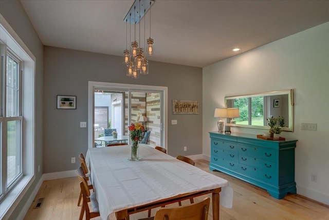 5508 Midmoor Rd, Monona, WI 53716 - dining area featuring light wood-style floors, baseboards, a chandelier, and recessed lighting