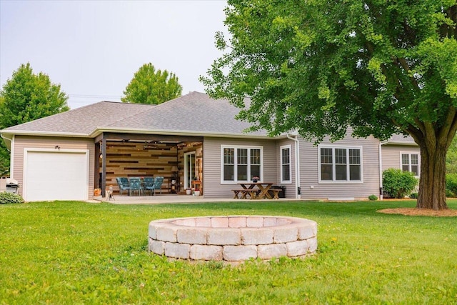5508 Midmoor Rd, Monona, WI 53716 - back of house with a yard, a garage, and a shingled roof