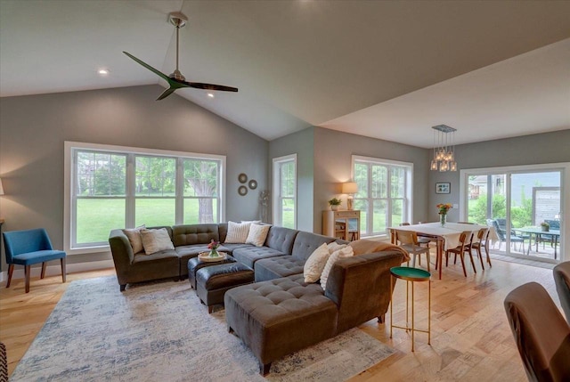 5508 Midmoor Rd, Monona, WI 53716 - living room with healthy amount of natural light, a ceiling fan, light wood-style floors, a chandelier, and vaulted ceiling