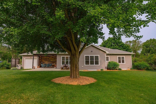 5508 Midmoor Rd, Monona, WI 53716 - back of property featuring a lawn and a patio