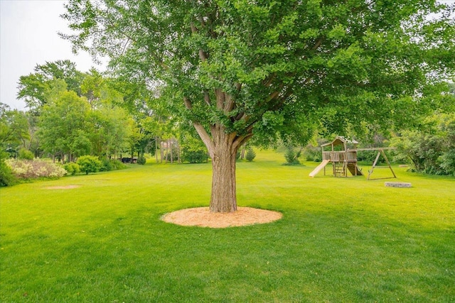 5508 Midmoor Rd, Monona, WI 53716 - view of green lawn featuring a playground