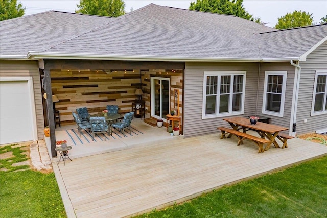 5508 Midmoor Rd, Monona, WI 53716 - wooden deck featuring outdoor dining space and a garage