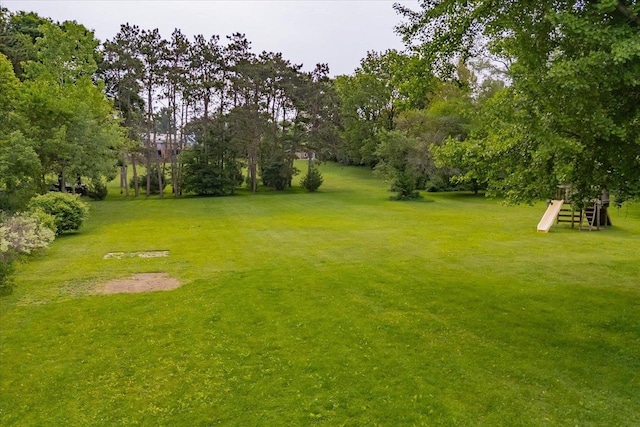 5508 Midmoor Rd, Monona, WI 53716 - view of green lawn with view of wooded area