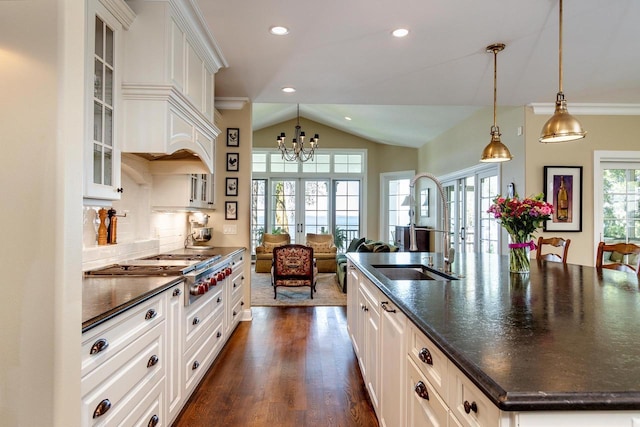 1834 Camelot Dr, Madison, WI 53705 - kitchen featuring french doors, a sink, stainless steel gas cooktop, vaulted ceiling, and glass insert cabinets