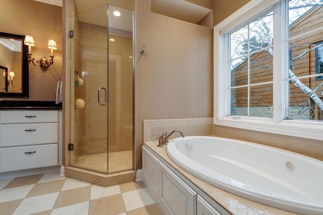 1834 Camelot Dr, Madison, WI 53705 - full bathroom with a garden tub, a stall shower, vanity, and tile patterned floors