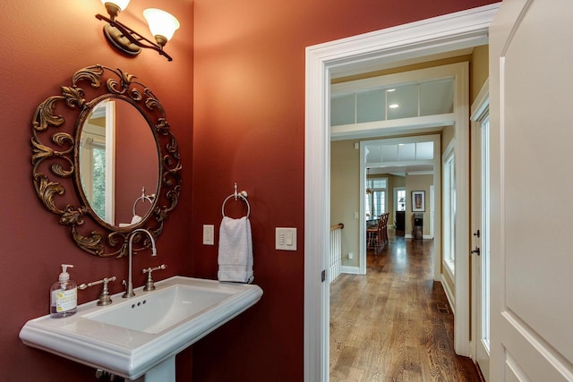 1834 Camelot Dr, Madison, WI 53705 - bathroom featuring wood finished floors, a sink, and baseboards