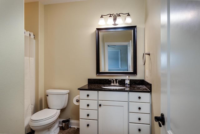 1834 Camelot Dr, Madison, WI 53705 - full bathroom with vanity, toilet, baseboards, tile patterned floors, and a shower with curtain
