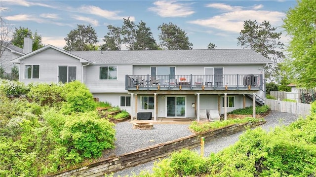 1604 Lake Rd, Altoona, WI 54720 - back of house featuring an outdoor fire pit, a wooden deck, a patio, and stairs