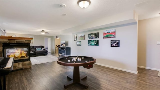 1604 Lake Rd, Altoona, WI 54720 - rec room with ceiling fan, wood finished floors, baseboards, and a stone fireplace
