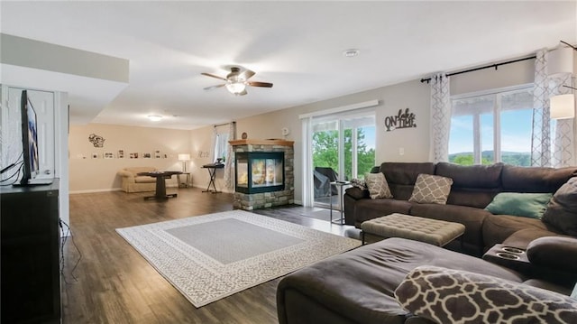 1604 Lake Rd, Altoona, WI 54720 - living area featuring ceiling fan, a fireplace, wood finished floors, and baseboards