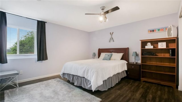 1604 Lake Rd, Altoona, WI 54720 - bedroom with dark wood-style floors, baseboards, and a ceiling fan